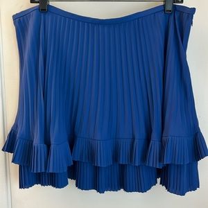Royal blue pleated mini skirt with ruffled hem
